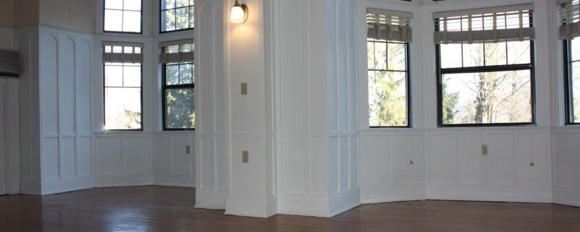 A model apartment living room full of natural light at Kenilworth Inn in Asheville, North Carolina