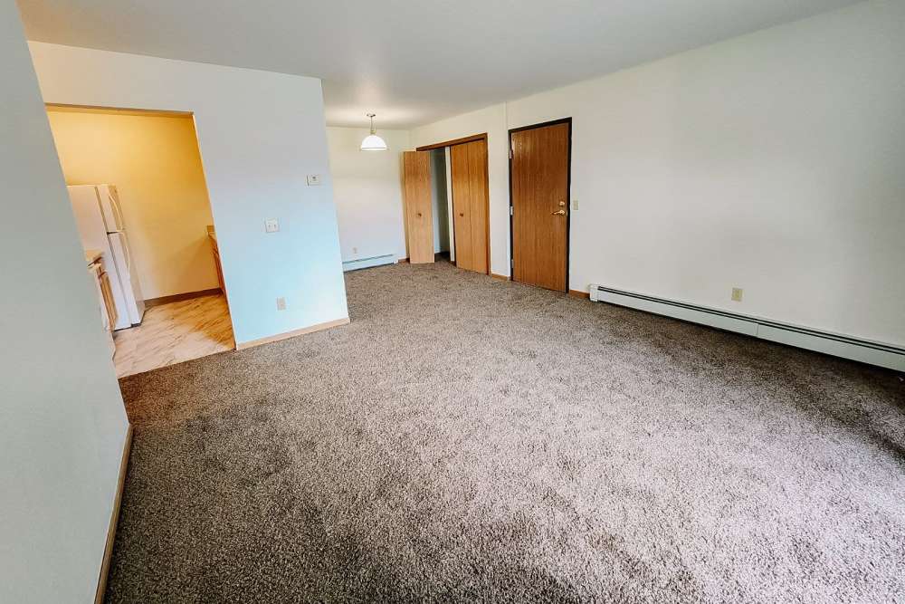 Spacious living room at Rivercrest Apartments in Croswell, Michigan