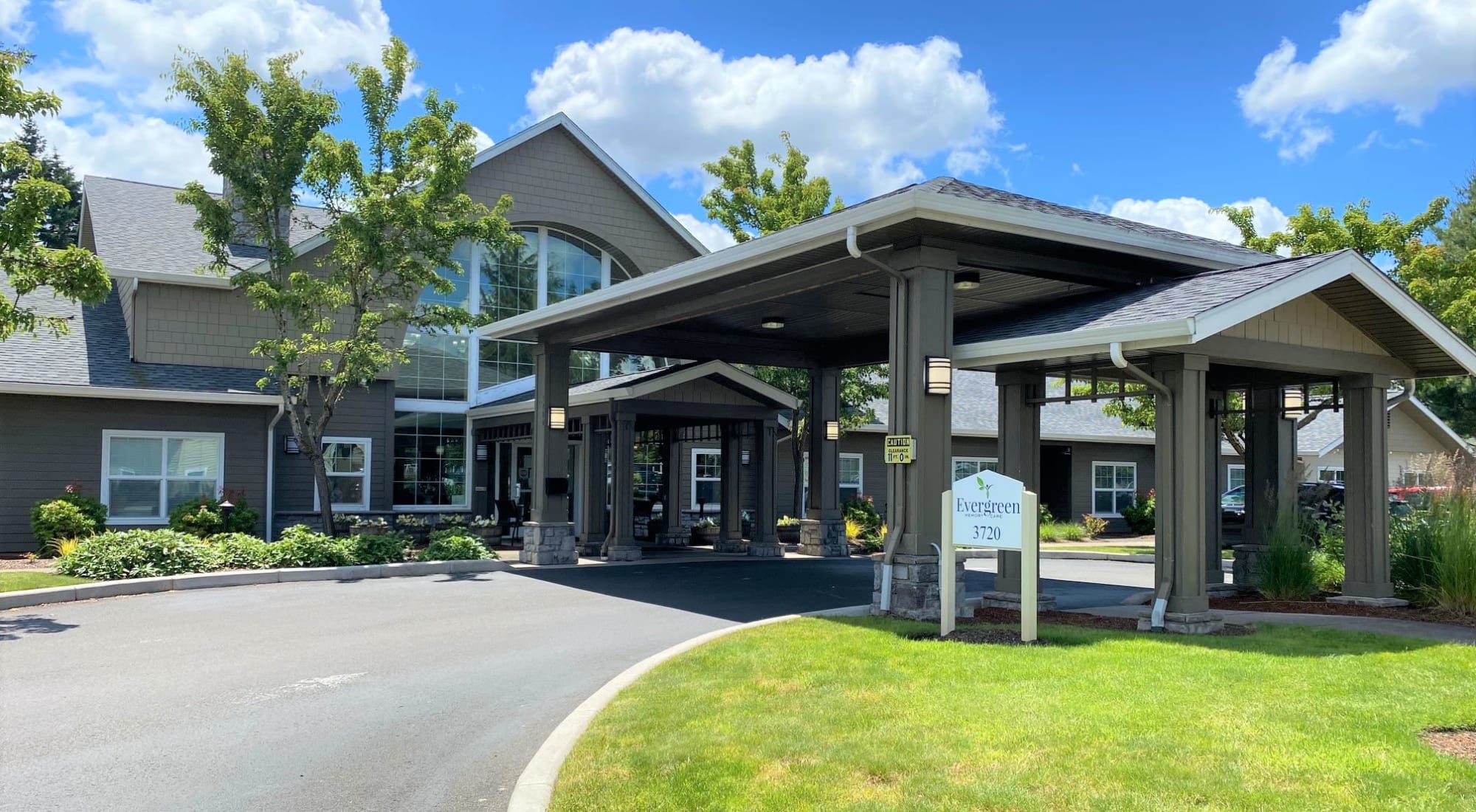 Sunny view of complex at Evergreen Memory Care in Eugene, Oregon