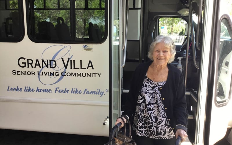 Resident getting off the Grand Villa bus after a trip at Grand Villa of Palm Coast in Palm Coast, Florida