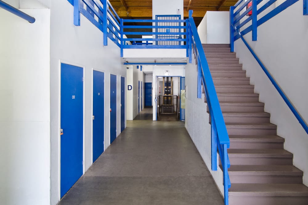 Ground-floor storage lockers and staircase at A-American Self Storage in Santa Barbara, California