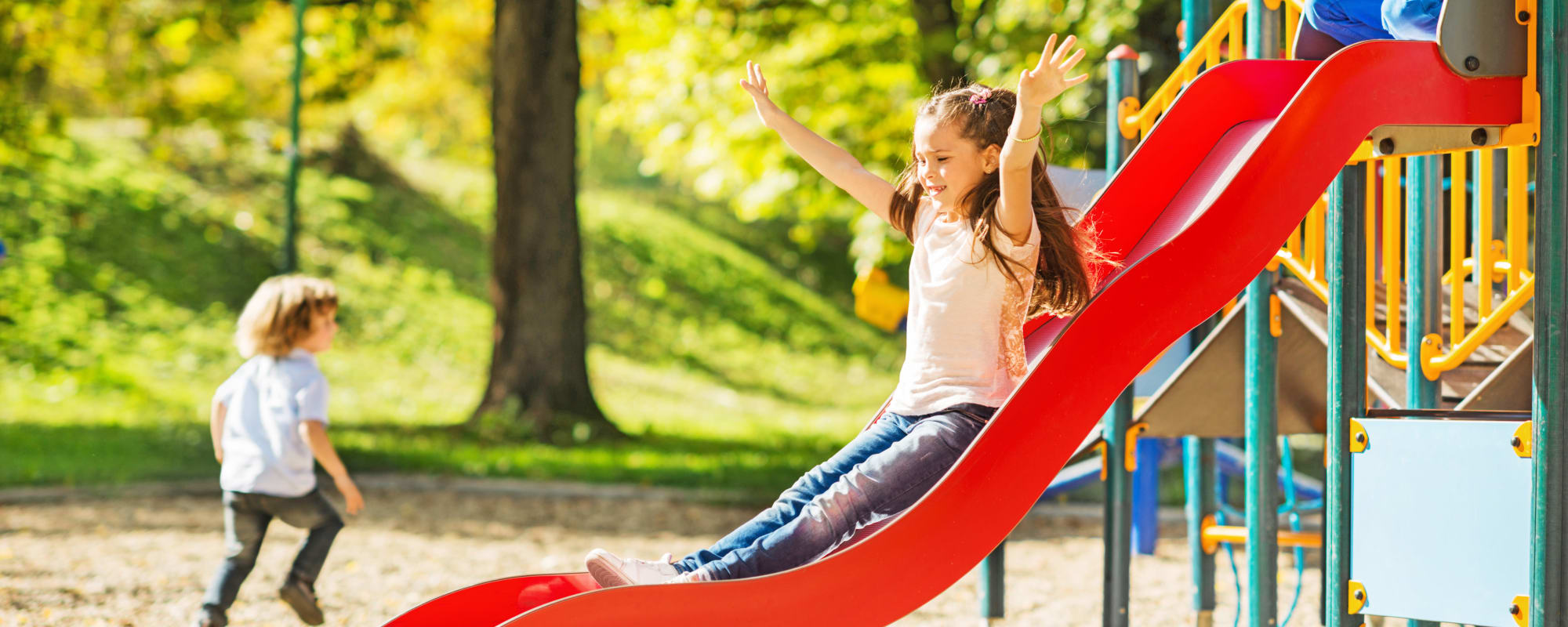 Happy kids playing in the playground at Hamilton Redoubt in Newport News, Virginia