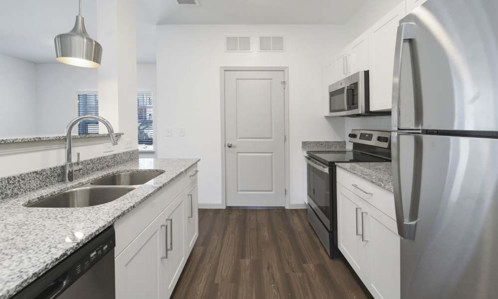 Kitchen with steel appliances at The Warrick in Nashville, Tennessee