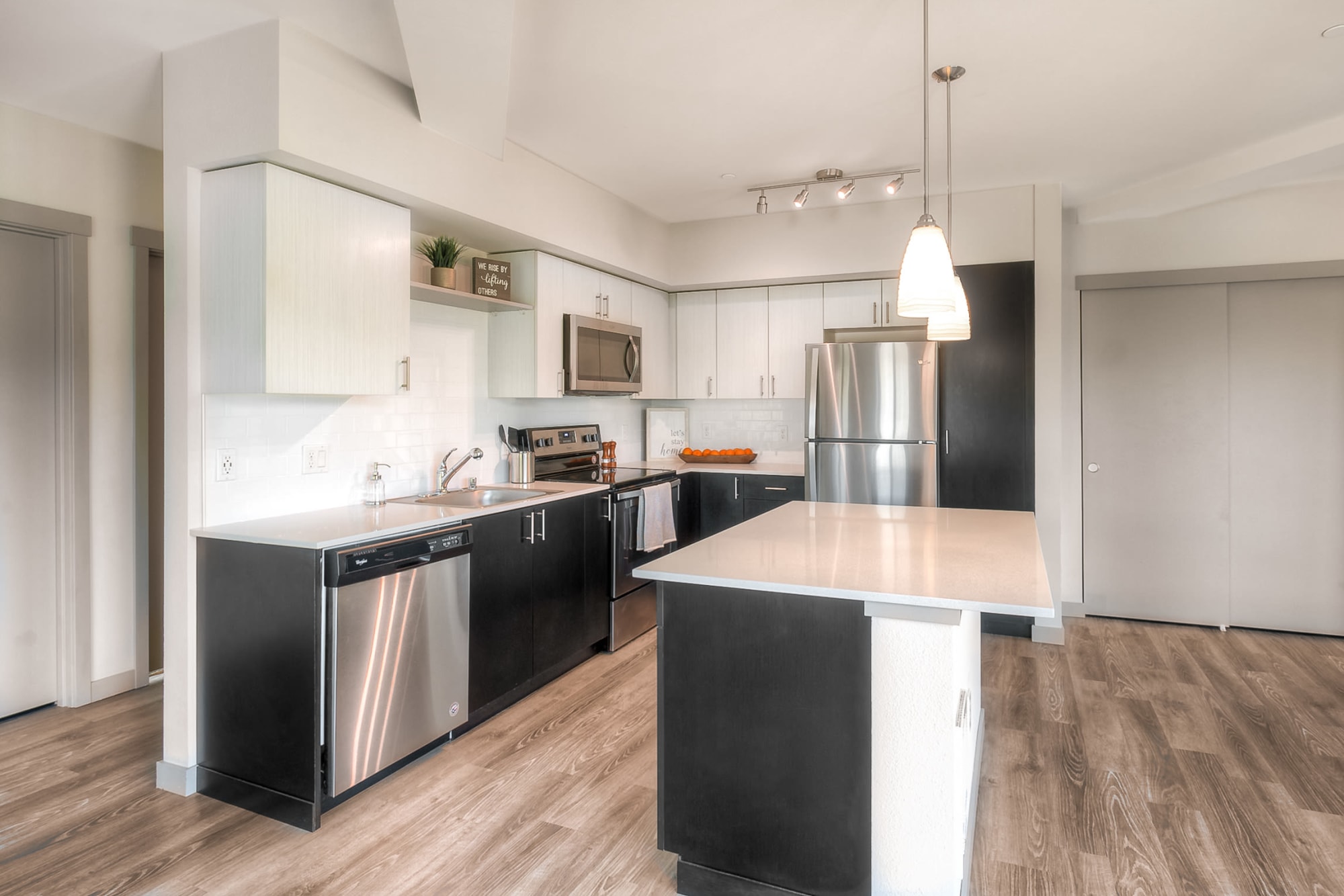 A kitchen with stainless appliances at Tria Apartments in Newcastle, Washington
