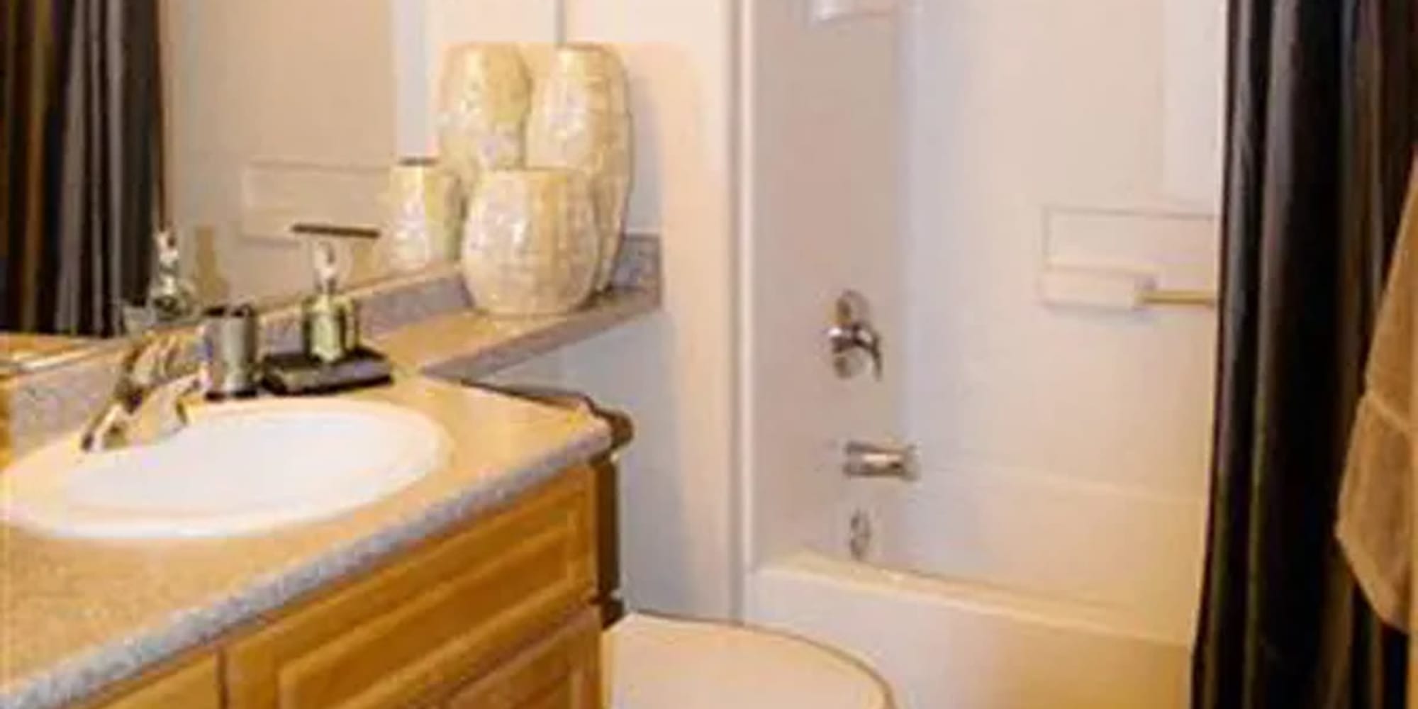 Bathroom with shower tub at Siena Villas Apartments in Elk Grove, California
