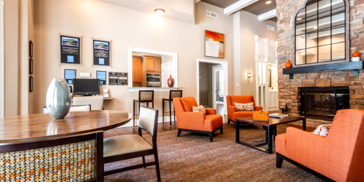 Community clubhouse sitting area with kitchen area at Marquis at Sugarloaf in Duluth, Georgia