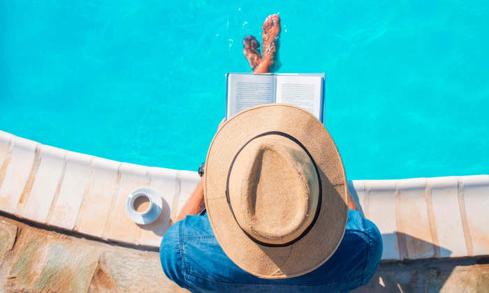 Resident watering a houseplant at The Heights at Happy Valley in Happy Valley, Oregon