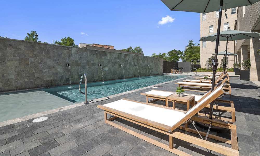 Lounge beds near swimming pool area at The Lofts at the Municipal in Lafayette, Louisiana