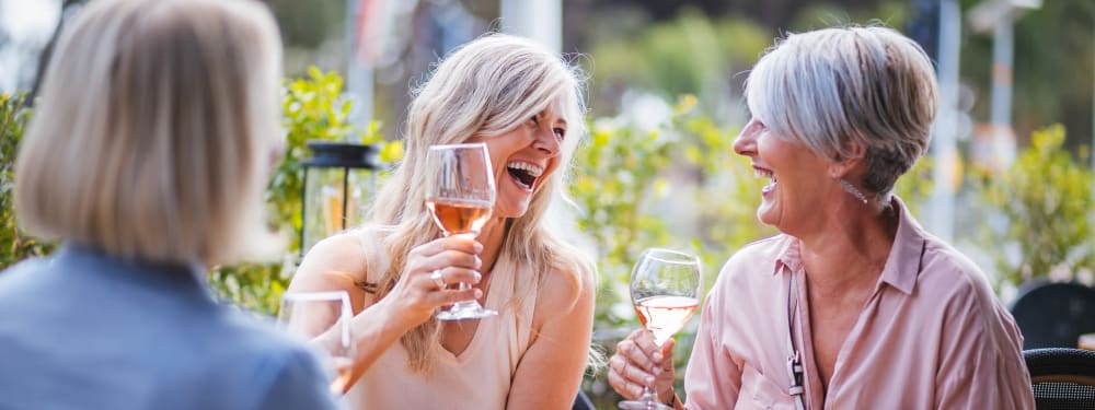 Friends gather for wine at Hawthorn Village Apartments in Napa, California