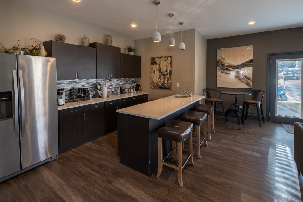 Modern kitchen with stainless steel appliances and granite countertops at Trails of Towne Lake in Irving, Texas