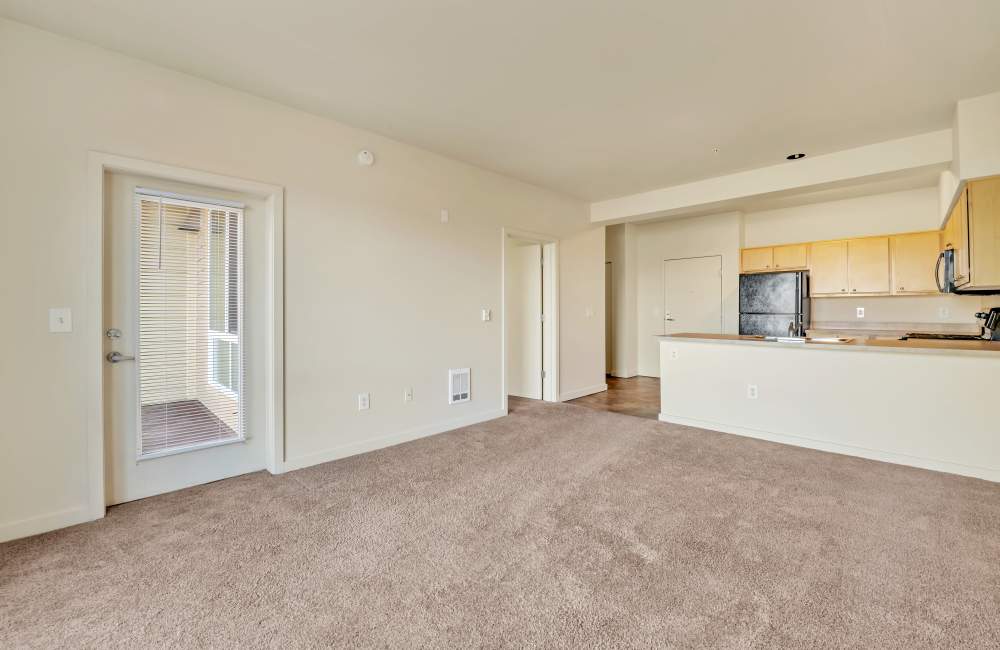 Living room with connecting kitchen at North Main Village in Milwaukie, Oregon