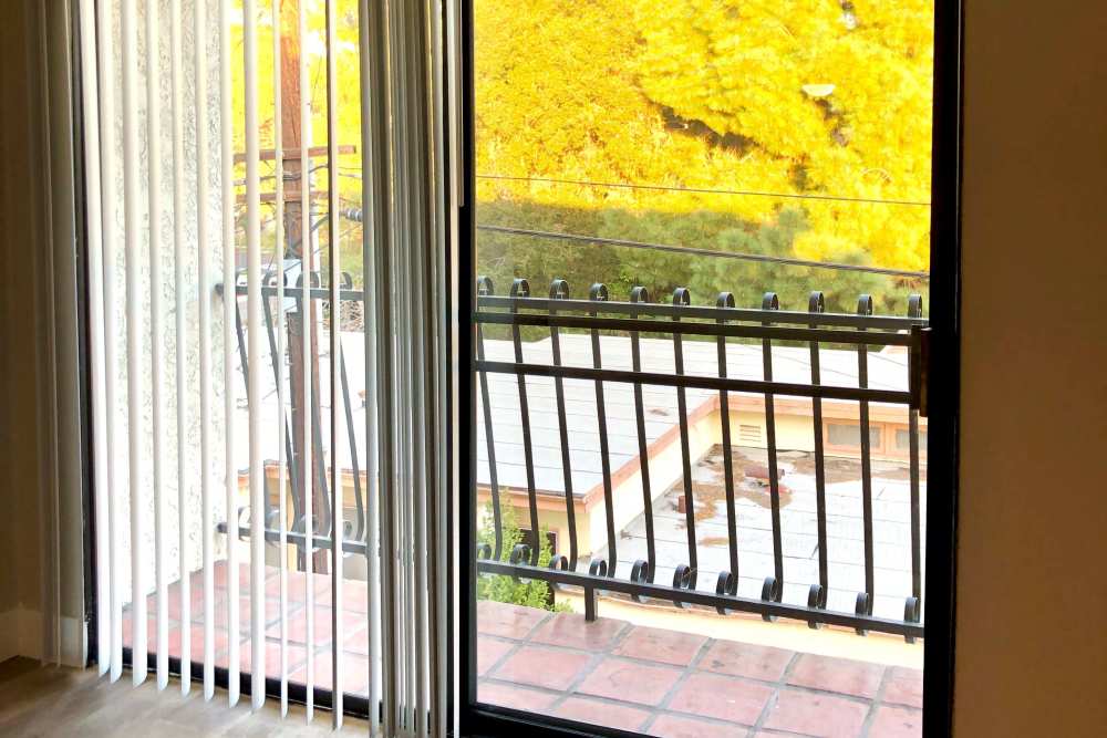 Sliding glass door with balcony view at The Indie Glendale Collection in Glendale, California