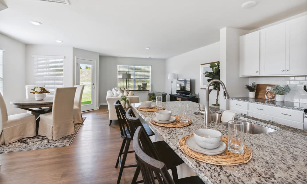 Model kitchen with a kitchen island at Lattitude34 Greenville in Greenville, South Carolina