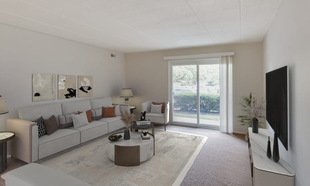 Carpeted living room at Vantage Pointe West Apartments in Cincinnati, Ohio