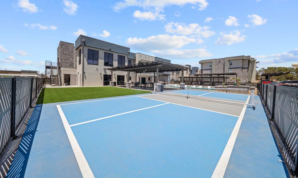 View of tennis court with patio at Retreat at Eastlake in El Paso, Texas