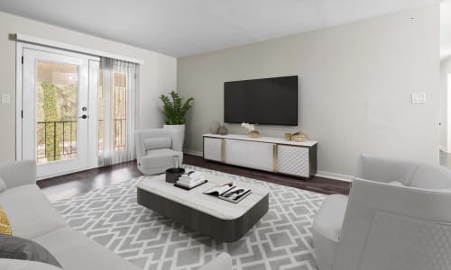 Hardwood flooring and furniture in a model apartment living room at Spring Creek Apartment Homes in Decatur, Georgia