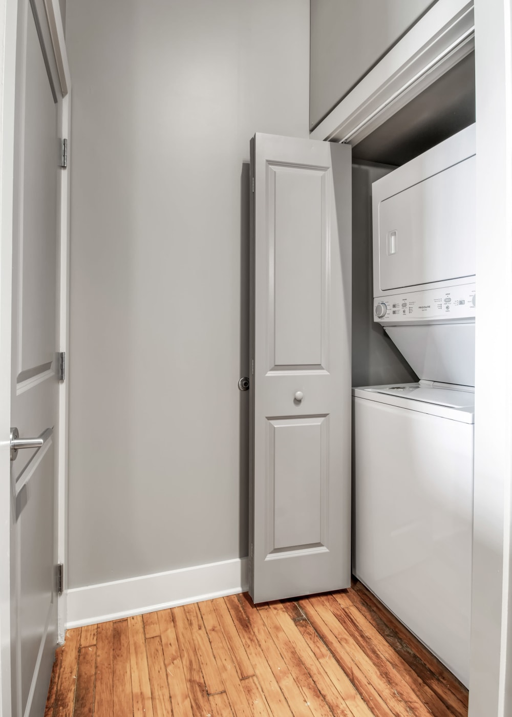 Stacked washer and dryer in an apartment at Barcalo Living in Buffalo, New York