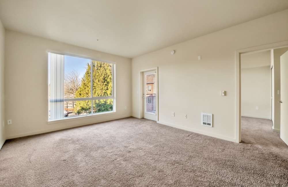 Bedroom with a window at North Main Village in Milwaukie, Oregon
