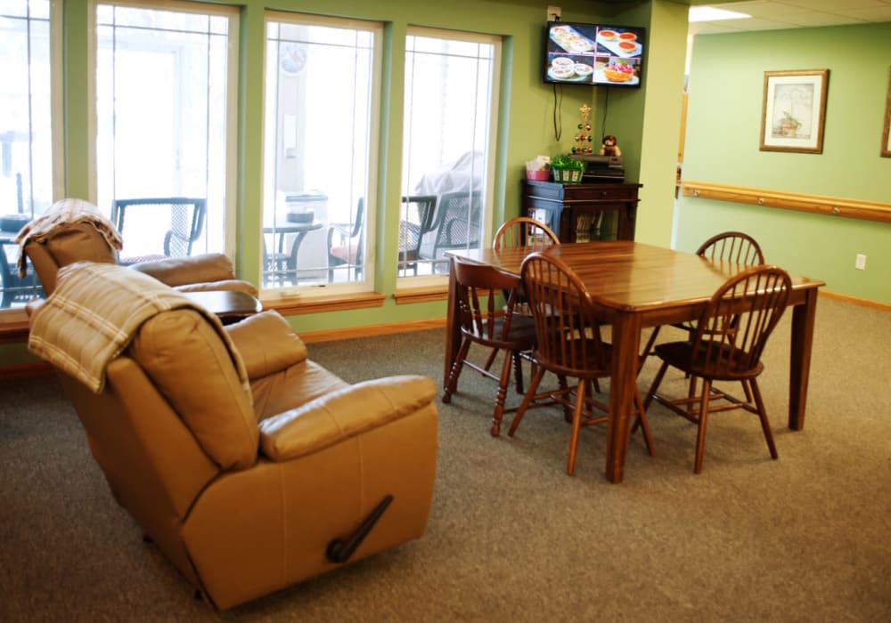 Common area with a tv for residents at The Residences on Forest Lane in Montello, Wisconsin