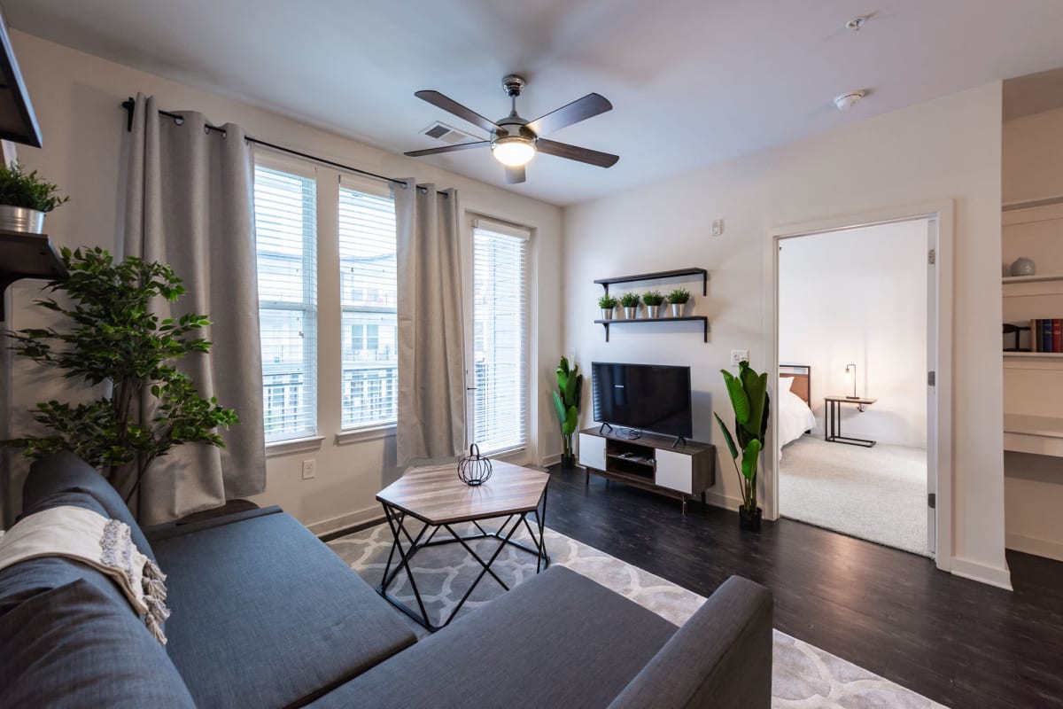 Wood-style flooring in an apartment living room at Station R Apartments in Atlanta, Georgia
