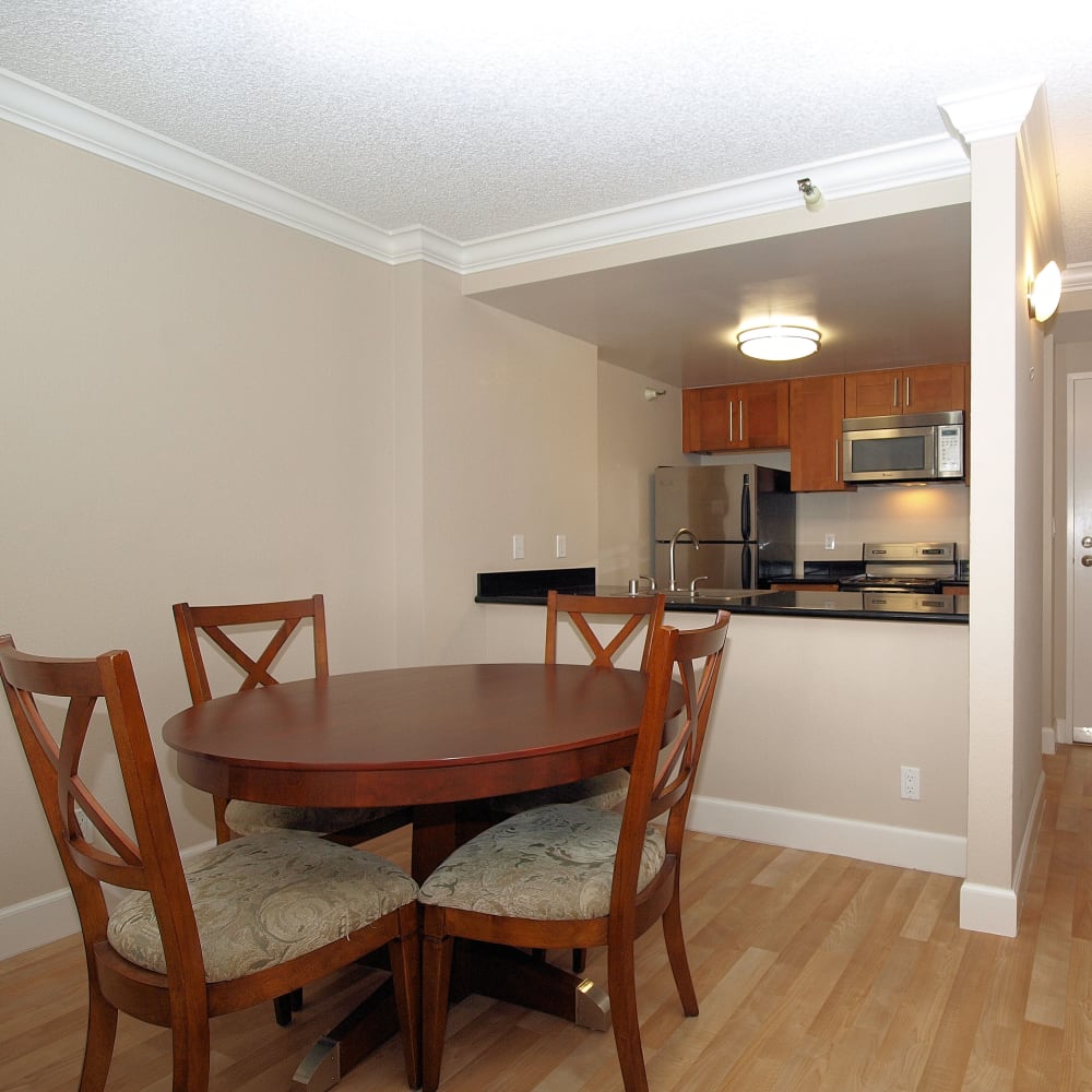 Kitchen with a pass-through window overlooking the dining room at Tower 737 Condominium Rentals in San Francisco, California