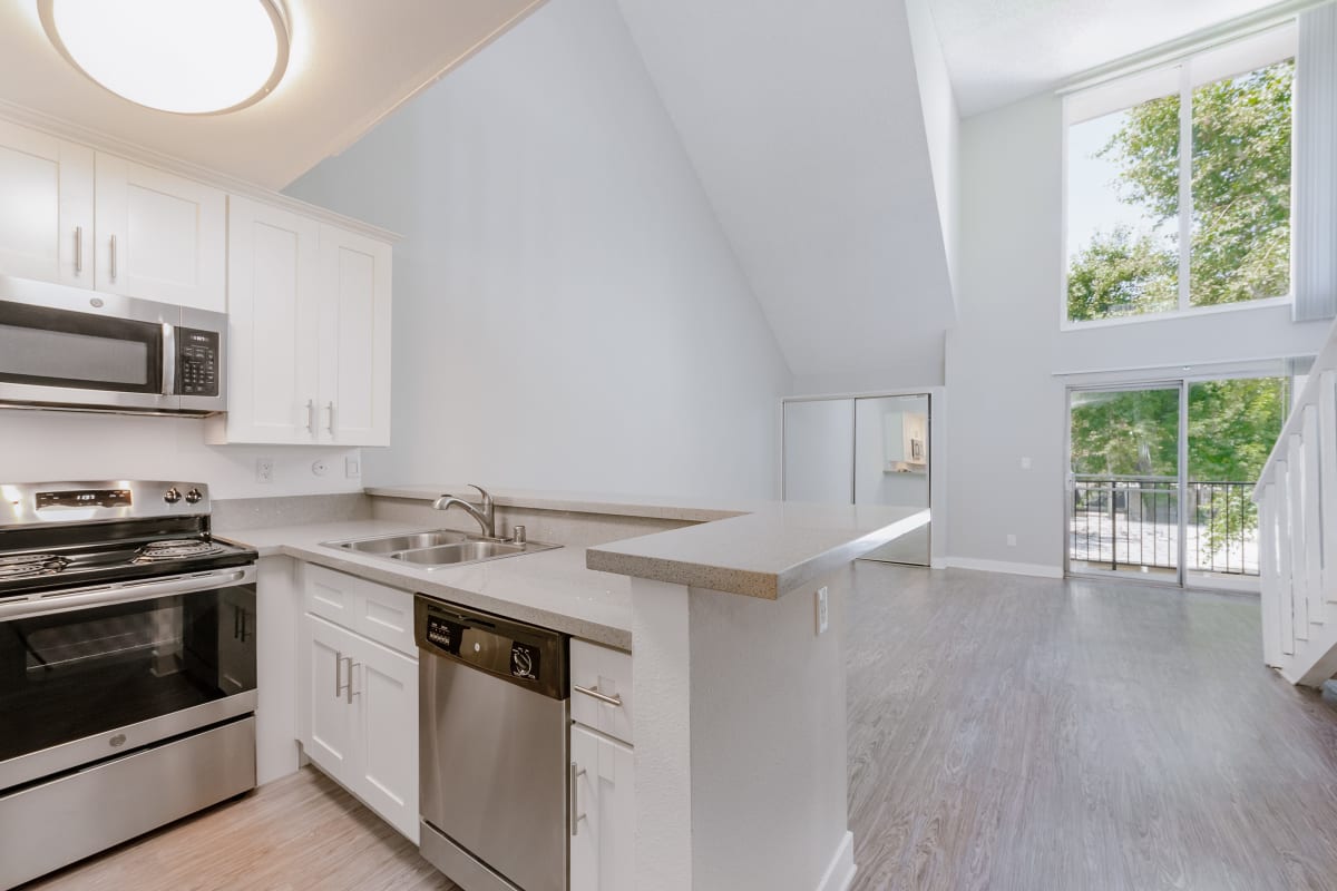 Kitchen with stainless-steel appliances at Los Feliz Village in Los Angeles, California