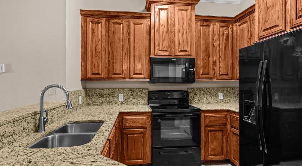 Kitchen with oven at The Arbors of Mineola in Mineola, Texas