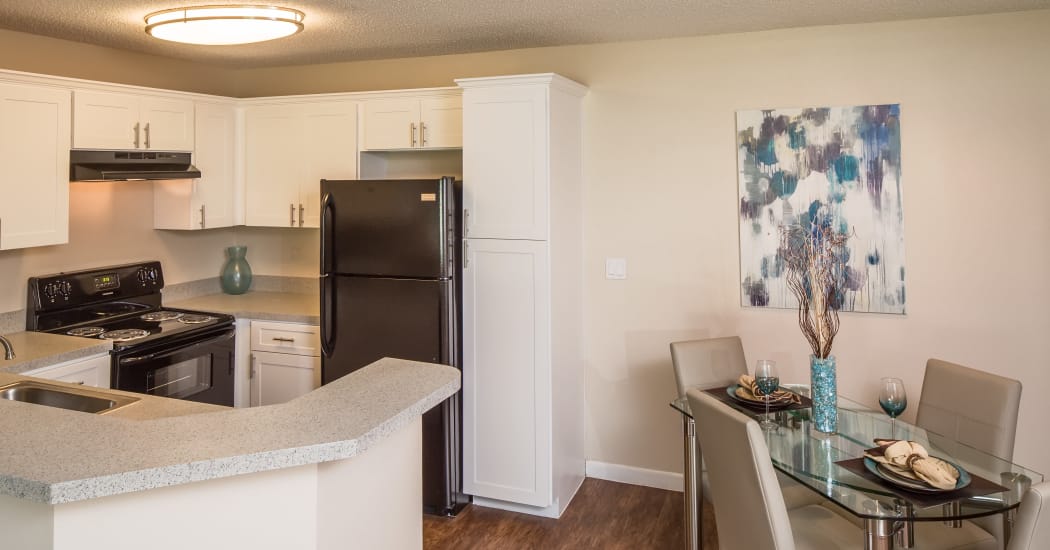 kitchen and dining area in Huntington Place apartment