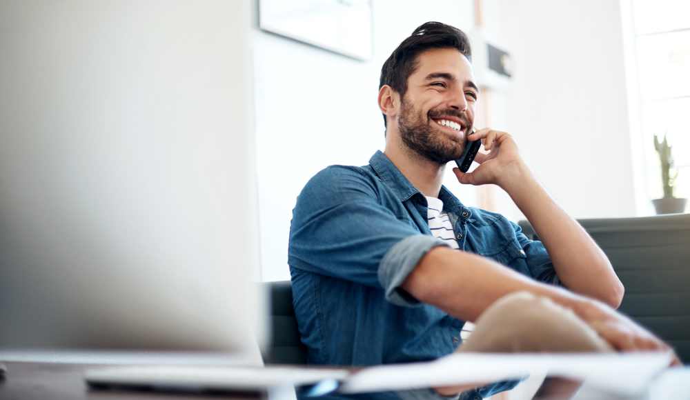 A resident using his mobile at El Jardin Apartments in Hollywood, Florida