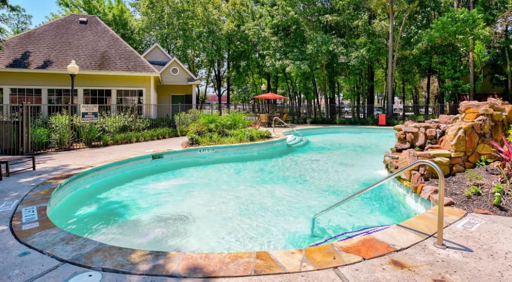 Exterior view of the pool at Eagle Crest Apartments in Humble, Texas