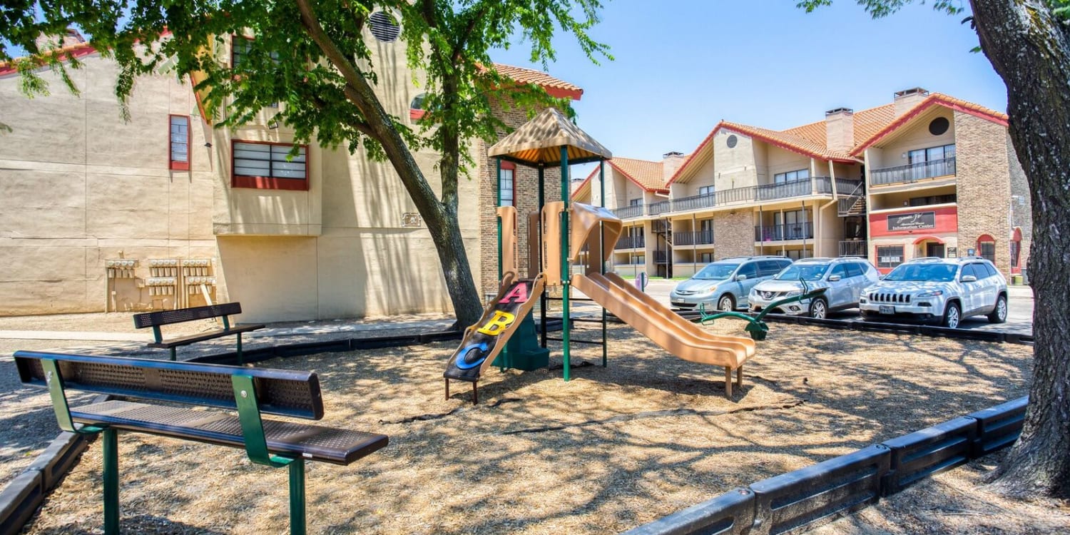 The community playground at Santa Fe Apartment Homes apartments in Dallas, Texas