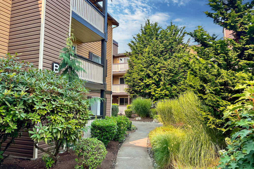Beautifully landscaped exterior view of property at Newport Crossing Apartments in Newcastle, Washington