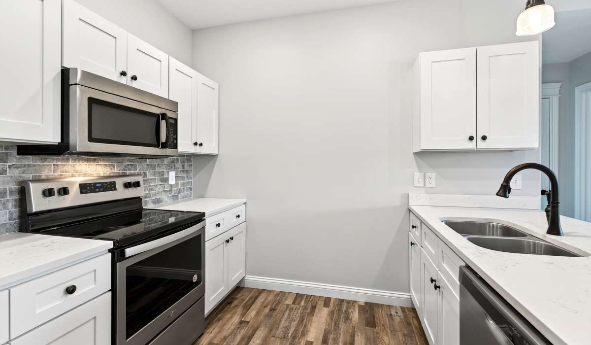Kitchen with white cabinetry and stainless-steel appliances at Palomar Woods in Lexington, Kentucky