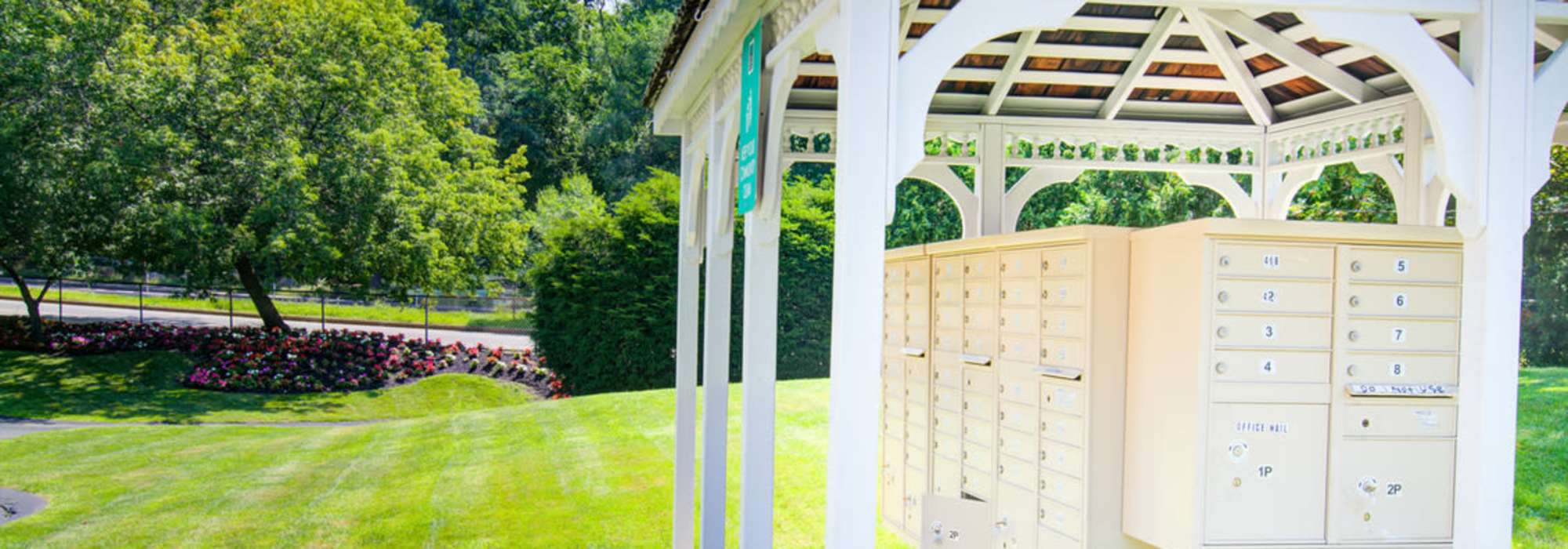 Green lawn outside of leasing office at with at Stony Brook Village in Hyde Park, Massachusetts