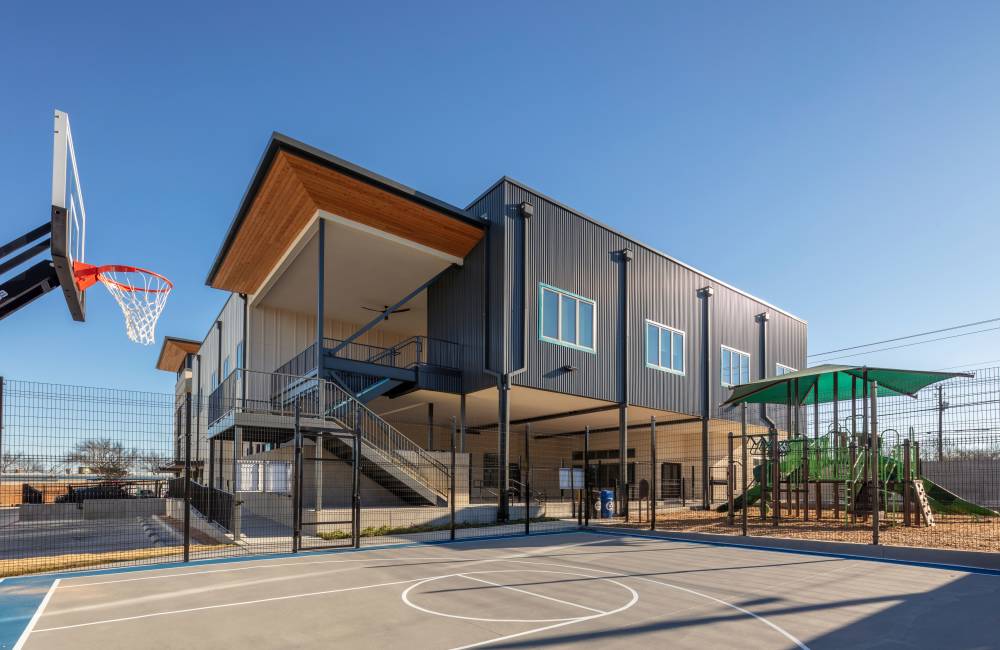 Playground and basketball court in the community at Laurel Creek Apartments in Austin, Texas