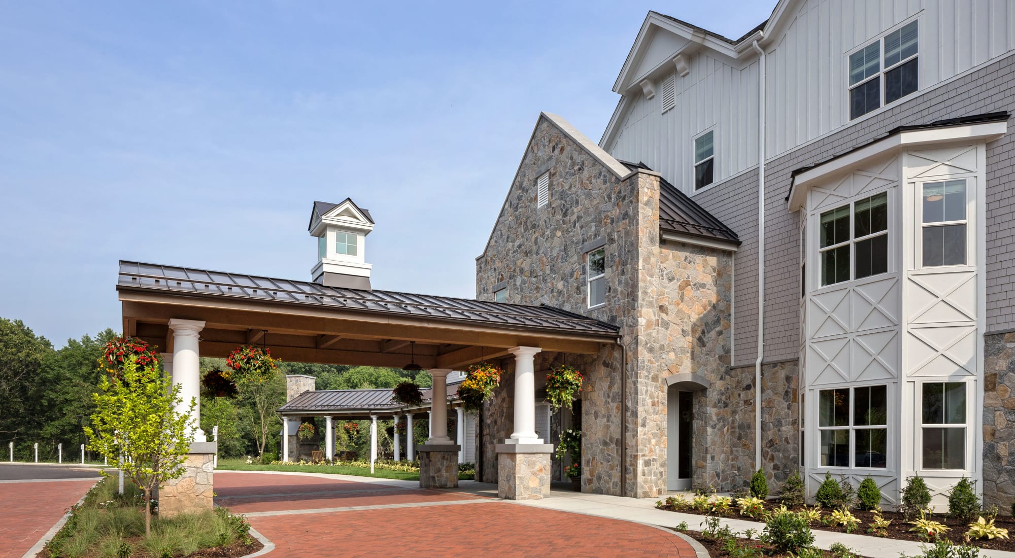 Building entrance at dusk in Maplewood at Southport in Southport, Connecticut