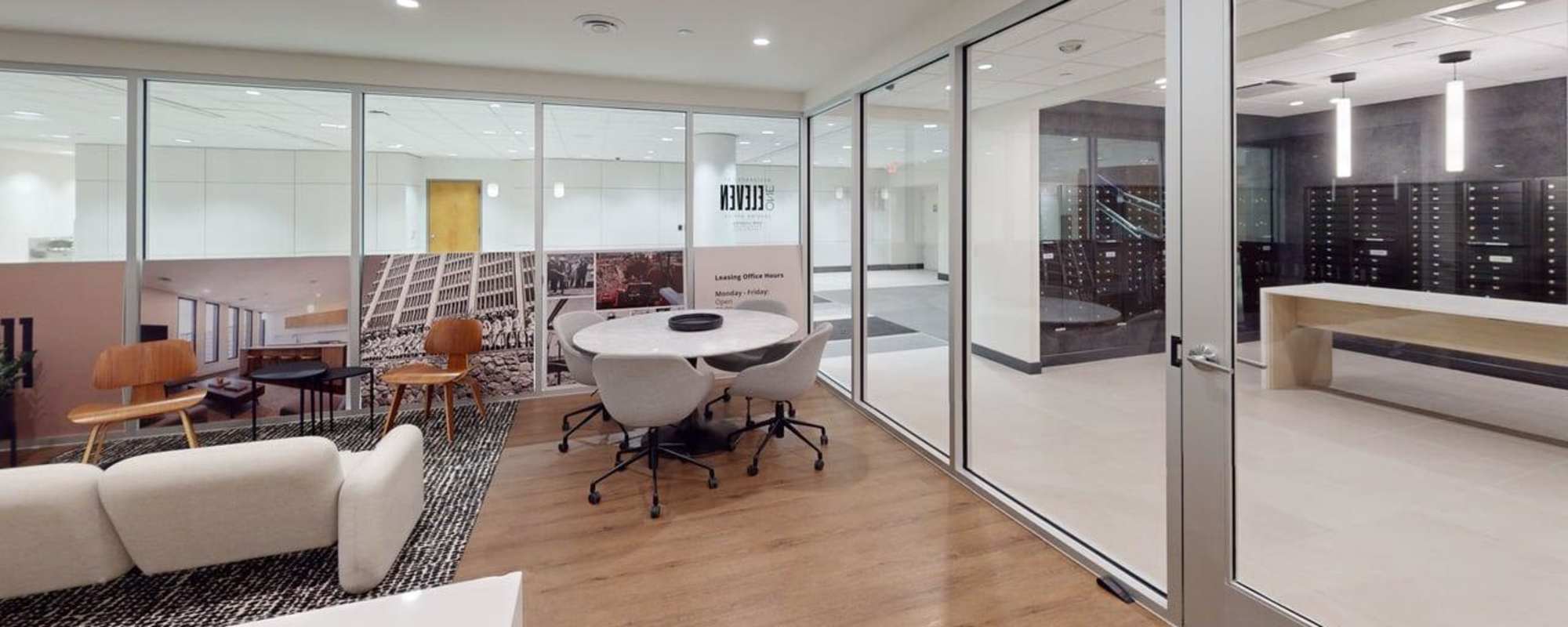 Resident lounge with putting green, TV, and social seating at Residences at 111 Lyon in Grand Rapids, Michigan