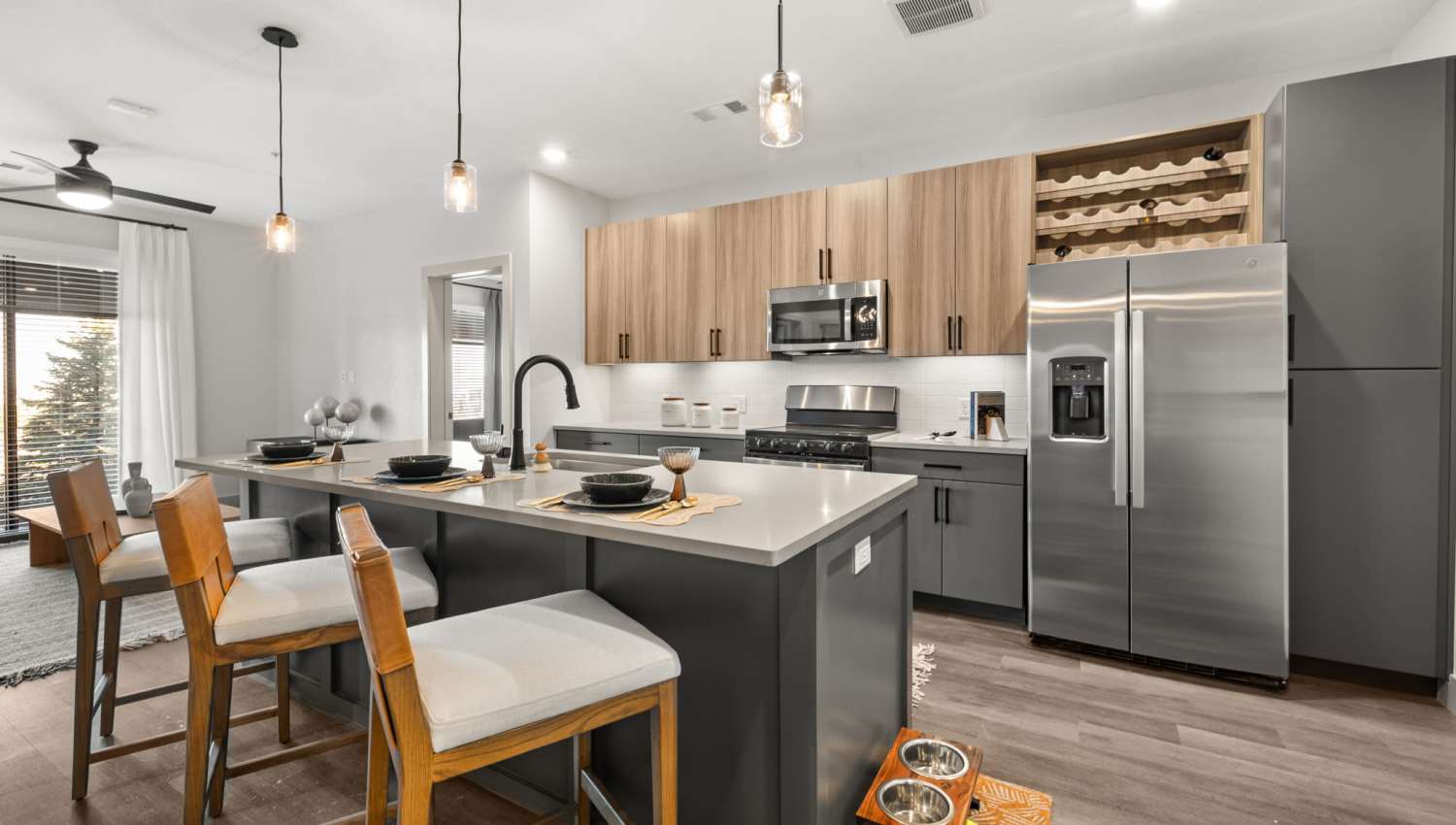 kitchen with wine rack above refrigerator at The Lock at Flatirons in Broomfield, Colorado