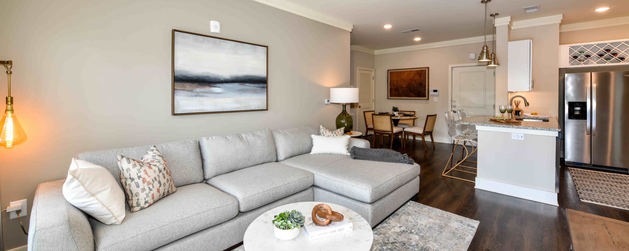 Spacious living room and kitchen of a model apartment at Somerset in McDonough, Georgia