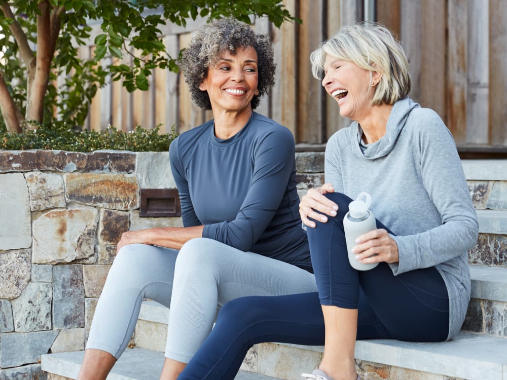 Residents chatting on the stoop outside their home at Harbor Point Apartments in Mill Valley, California