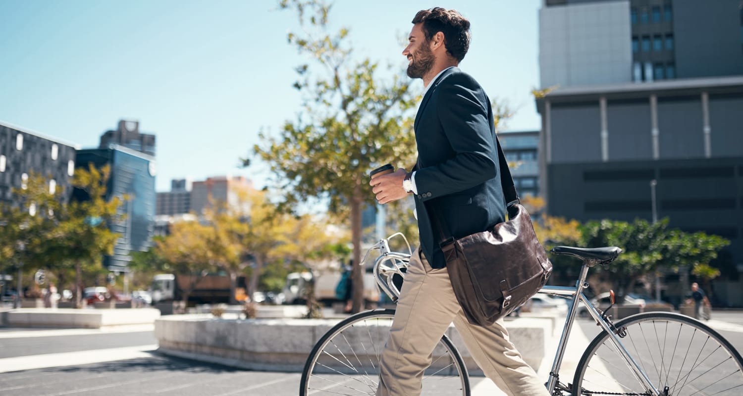 Resident walking holding his bike nearby at The Vivian in Atlanta, Georgia