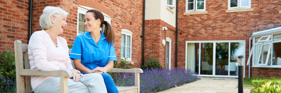 Resident talking with their caregiver at East Troy Manor in East Troy, Wisconsin