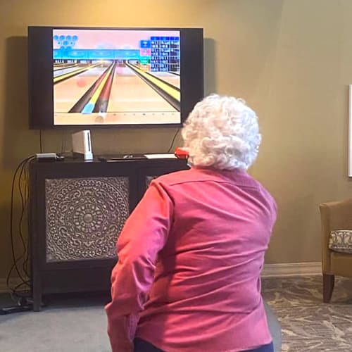 Resident video bowling at The Oxford Grand Assisted Living & Memory Care in Kansas City, Missouri