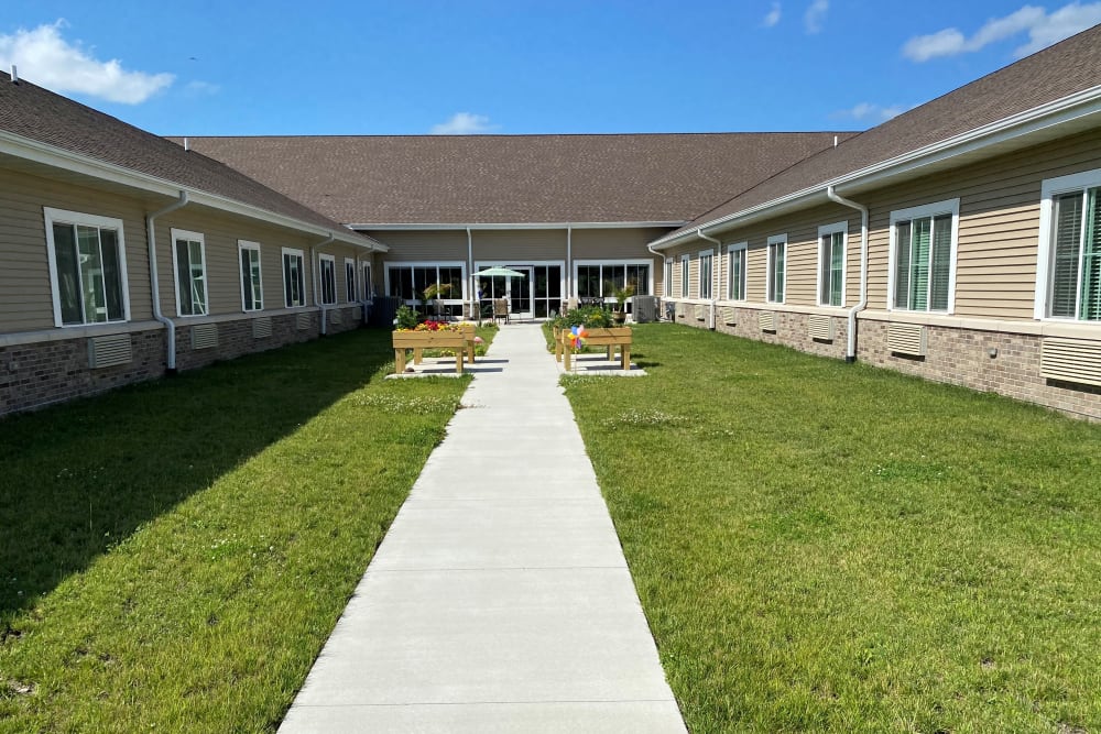 Enclosed courtyard with walking path at Country Meadow Place in Mason City, Iowa