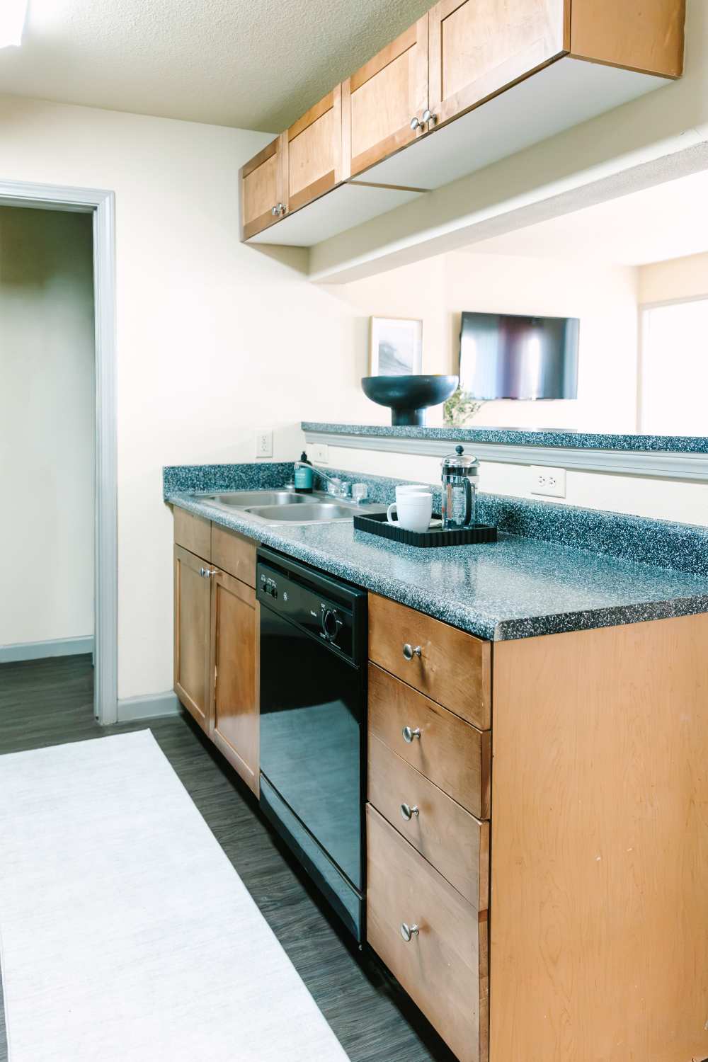 Granite countertop sink, and black appliances for the kitchen at The Holly in Lubbock, Texas