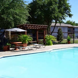 Swimming pool and poolside picnic tables at River Ranch in Sherman, Texas