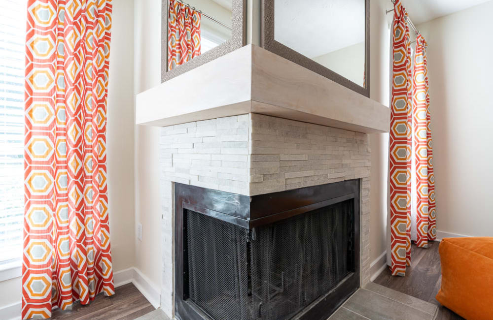 Fireplace in an apartment living room at The Hundred Exchange in Fayetteville, Georgia