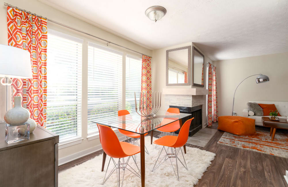 Dining area and living room in an apartment at The Hundred Exchange in Fayetteville, Georgia5