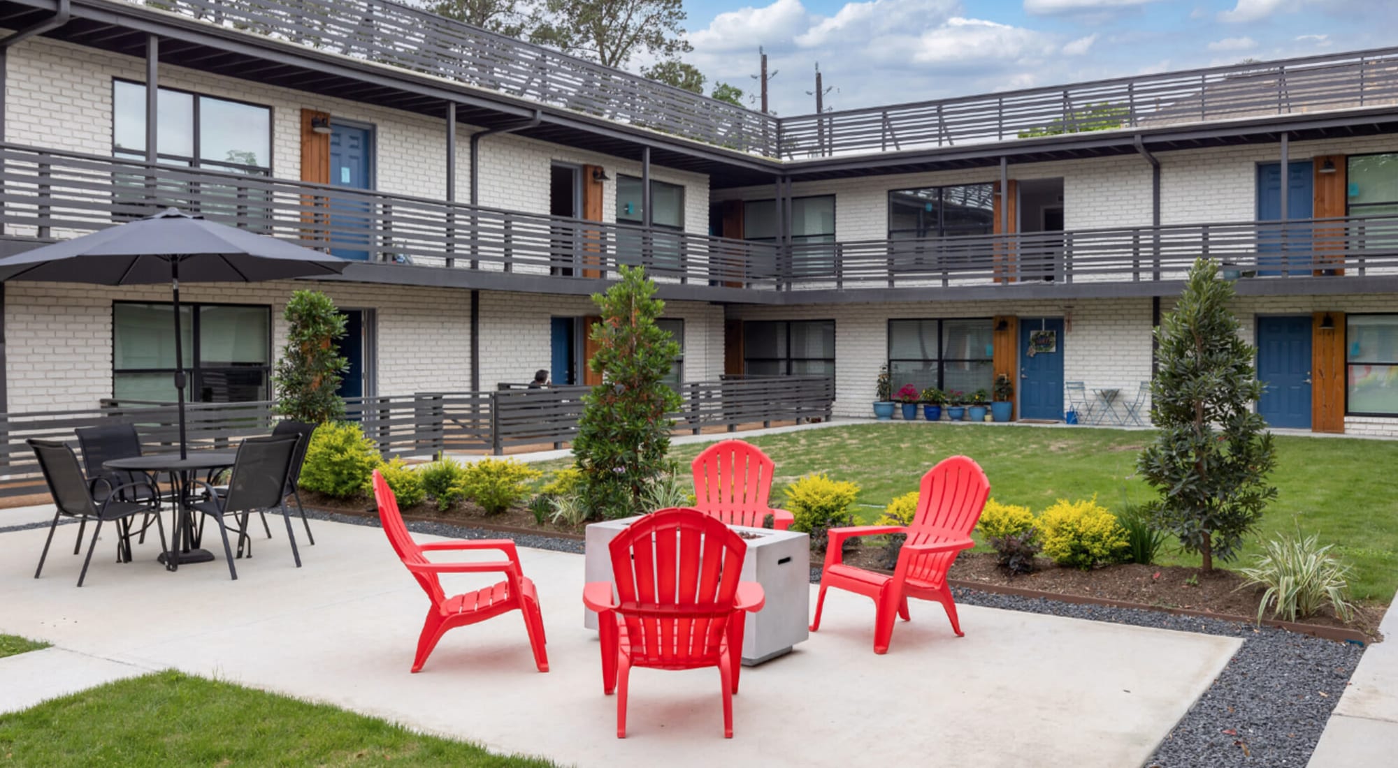 Courtyard with sitting area and firepit at Melrose in Houston, Texas