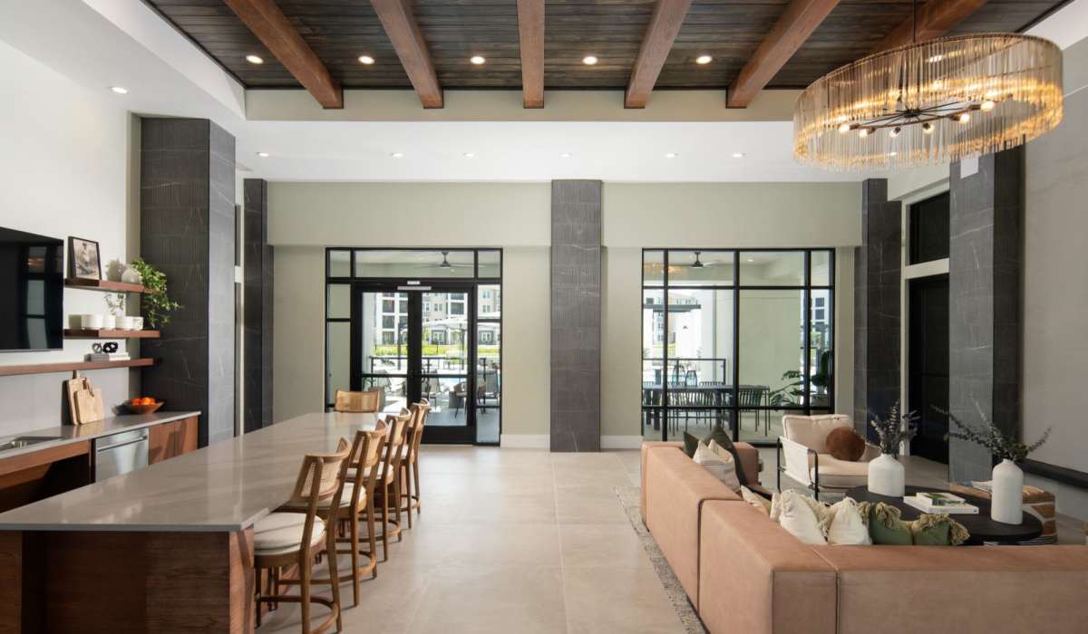Clubhouse with raised chairs and flat-screen TV at Afton Palms in Sanford, Florida